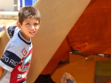 Refugee child in Ankaway, Erbil at the opening of his tent_Catholic News Agency. 