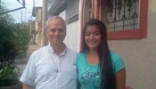 Mildred, the Peruvian goddaughter of Pope Leo XIV, with then-Father Robert Prevost.