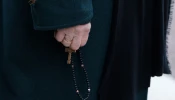 An attendee prays the rosary during a demonstration called by the association “La Marche pour la vie” against abortion and euthanasia in Versailles, southwest of Paris, on March 4, 2024.