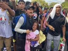 Migrants argue with Panamanian National Border Service members as they try to cross the border between Panama and Costa Rica while trying to return to Venezuela at Paso Canoas between the Panama-Costa Rica border on Feb. 11, 2025. Dozens of Venezuelan migrants crossed the border from Costa Rica into Panama in a small caravan as they gave up the journey to the United States.