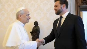 Pope Leo XIV shakes hands with U.S. President JD Vance in the papal library. The two had a private encounter before they were joined by U.S. Secretary of State Marco Rubio on May 19, 2025.